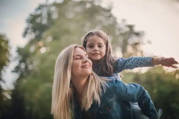 happy mum and daughter following mediation to resolve parental alienation Bolton